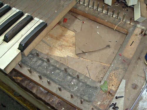 A Pump Organ under restoration with some of the treble keys removed